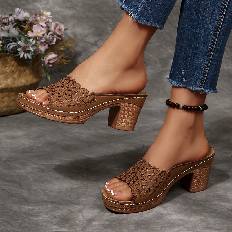 Women's floral cut-out mules—open-toe, slip-on sandals featuring a platform and block heel.