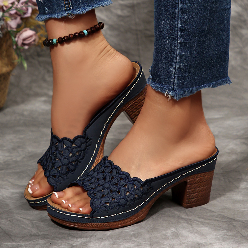 Women's floral cut-out mules—open-toe, slip-on sandals featuring a platform and block heel.