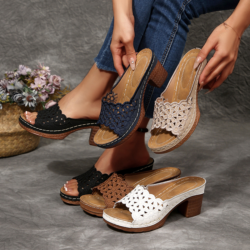 Women's floral cut-out mules—open-toe, slip-on sandals featuring a platform and block heel.